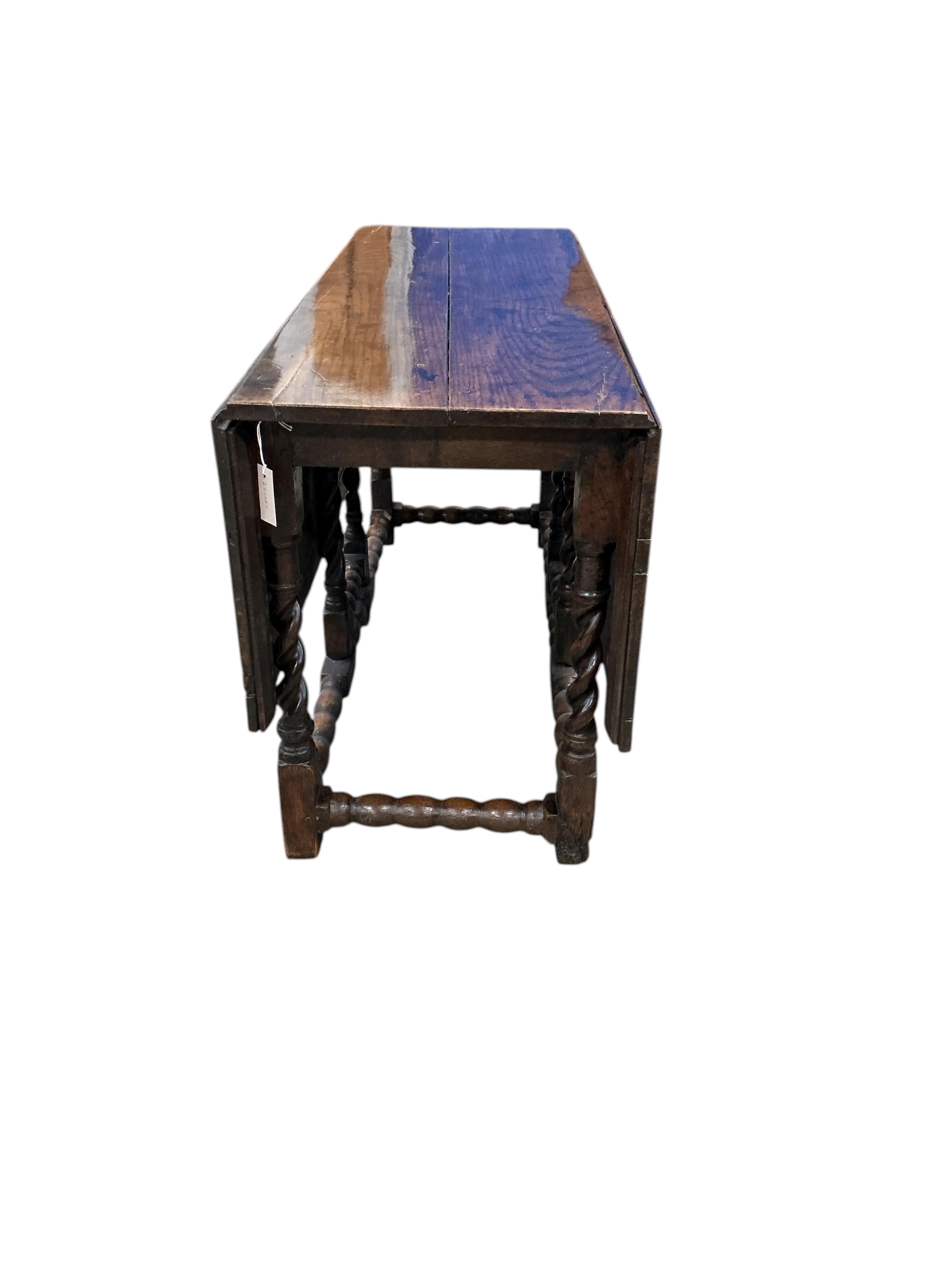 A late 17th / early 18th century oak gateleg table with barley twist legs, width 134cm, length 140cm extended, height 73cm